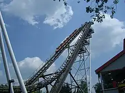 A view of a train ascending the catch car lift hill when it was known as the Sidewinder. The train is located on the left of the two lift hills.