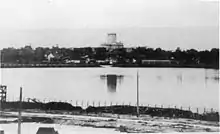 Destroyed bridge over a river, black and white