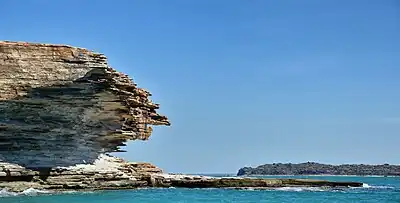 Rock formations on a small island within the group