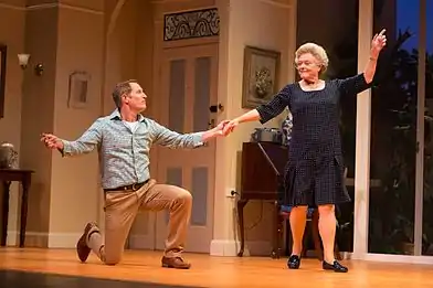 Todd McKenney (kneeling) and Nancye Hayes (standing) while dancing the swing in a performance of the play Six Dance Lessons in Six Weeks