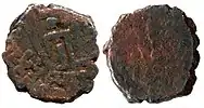 Coin of Sodasa, satrap of Mathura, AE. Obv: Lakshmi standing between two symbols on the obverse and inscription around "Mahakhatapasa putasa Khatapasa Sodasasa ".Rev: Standing Abhiseka Lakshmi anointed by two elephants.