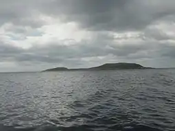 Soyea Island off Loch Inver is seen here in a view from a sea kayak passing Kirkaig Point.