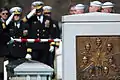 A casket team from the United States Navy folds the flag covering the casket of NASA Astronaut and U.S. Navy Captain Laurel Blair Salton Clark, who died in the Space Shuttle Columbia disaster in 2003.