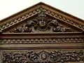 Carved pediment in music room