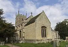 A stone church with a Gothic tower