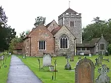 A stone church with a Gothic tower