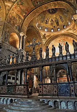 marble altar screen with statues on top