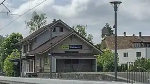 Two-story station building with gabled roof