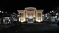 The station front facade at night