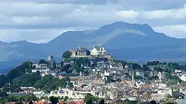 The skyline of Stirling, with the castle at the top of the hill and Stùc a' Chroin mountain behind