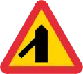 Skewed side road priority on left