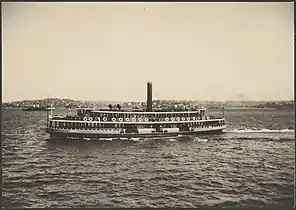 Kiandra in her original livery varnished timber, with grey and white trim