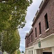 leaves are changing colors, a cloudy sky, tacoma armory crenelations