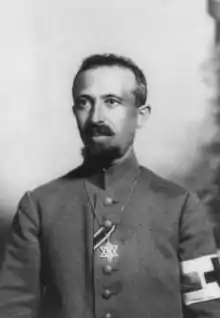 Military Field Rabbi Dr. Aaron Tänzer during World War I, with the ribbon of the Iron Cross. The brassard of the red cross shows him as noncombatant. He wears the Star of David as insignium