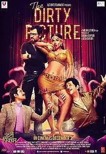 A poster that features four people. From left, a man wearing a suit kneels down with a rose in his hand. A man wearing glasses looks away with a disgruntled expression. A provocatively dressed woman stands in a sensuous manner, with her lips slightly open. The third man holds the woman's thigh and smiles gleefully.