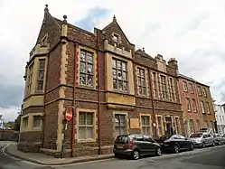 Three-storey red stone building