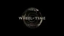 Series logo shows the words The Wheel of Time on top of a coiled silver snake