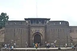 Stone fortress, with people in front for scale