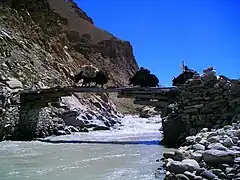 Complex Tibetan log bridge made of multiple logs (a cantilever bridge)