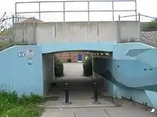 Short pedestrian underpass beneath a railway line