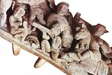 17th century wood relief showing arquebusier alongside mounted archer, Hương Canh Communal house