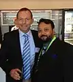 Koch is with Tony Abbott in 2012.