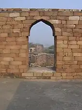 A corbel arch with the masonry cut into an arch shape