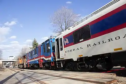 DOTX-218 and DOTX-220 behind a BNSF locomotive