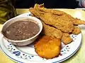 Fried catfish, purple hull peas, and hot water cornbread