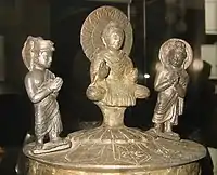 The Kushan Kanishka casket of 127, with (left to right) Brahma, the Buddha and Indra.