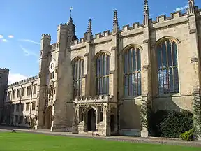 A photograph of the front of the chapel of Trinity College. The Chapel itself is a white building with arches and large glass windows