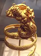 Gold armband with a bearded triton