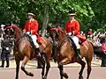 Outriders from the Royal Mews, wearing scarlet livery