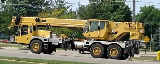 A Grove truck-mounted crane in road travel configuration