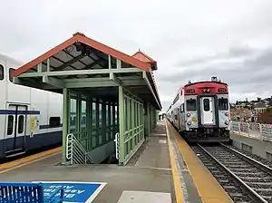 Two trains at an elevated railroad station