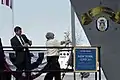 Ship sponsor Dotty England smashes the traditional bottle of champagne on New York's hull during the christening ceremony on 1 March 2008