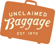 A silhouette of a suitcase with the text "Unclaimed Baggage, Est. 1970"