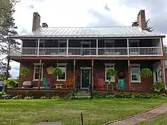 Rear of the house, with a porch on both floors