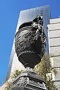 Bronze vases are placed among the monuments