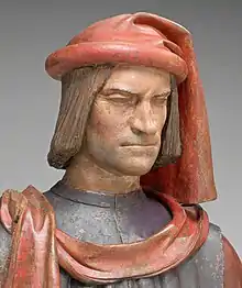 Lorenzo de Medici after Verrocchio, later than 1478, wearing a rather simple chaperon. The larger styles are now outdated, plus he is projecting a political message as Pater Patriae. See link below for post-restoration photos.