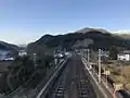 A view of the station platforms and tracks. The Hitahikosan Line can be seen turning off to the right.