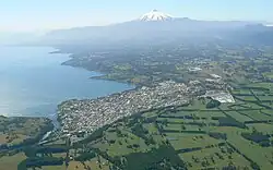 Aerial view of Lake Villarrica, the town of Villarrica and Villarrica Volcano