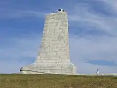 Wing-shaped monument on a summy day