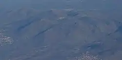 Aerial view of the hills North of Orahovac with the small village in the centre