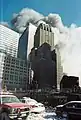 WTC 7 burning behind the Verizon Building.