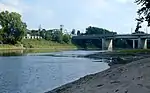 The Wabash River at Lafayette, Indiana, showing the Myers Pedestrian Bridge, and the Amtrak station. The river flows from left to right (north to south). This stretch is notable for large, sandy deposits.