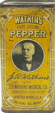 The front side of a vintage Watkins pepper tin