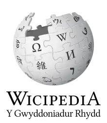 Wikipedia logo showing "Wikipedia: The Free Encyclopedia" in Welsh