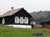 A wooden house in Bolshiye Koty, representative of typical style with ornate windows