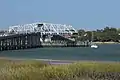 The bridge is shown in the open position to allow a sailboat to pass.